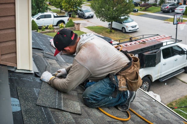 Professional Storm Damage Roof Repair technician working in Manton, MI
